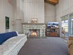 Main Level Living Room with Wood Burning Fireplace & Flat Screen TV